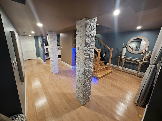 1010 6th St, Bay City, MI 48708 - basement featuring hardwood / wood-style floors, stairway, baseboards, recessed lighting, and fridge