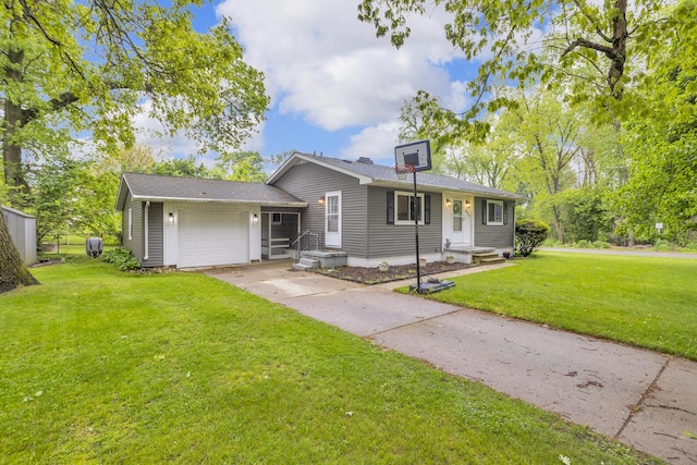 623 Pawnee St, Jackson, MI 49203 - view of front of property featuring an attached garage, a front yard, and driveway