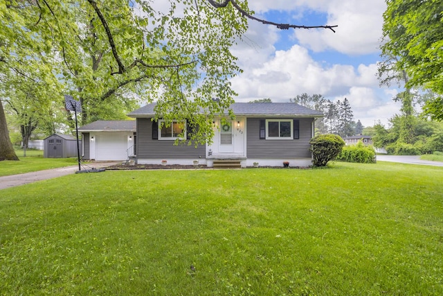 623 Pawnee St, Jackson, MI 49203 - view of front of house with a front lawn, concrete driveway, and an attached garage