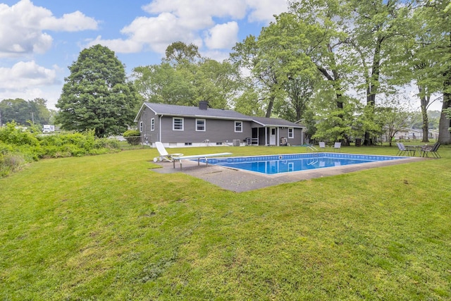 623 Pawnee St, Jackson, MI 49203 - swimming pool featuring a patio and a yard