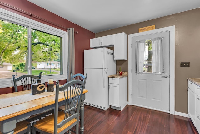 623 Pawnee St, Jackson, MI 49203 - dining room featuring dark wood finished floors and baseboards