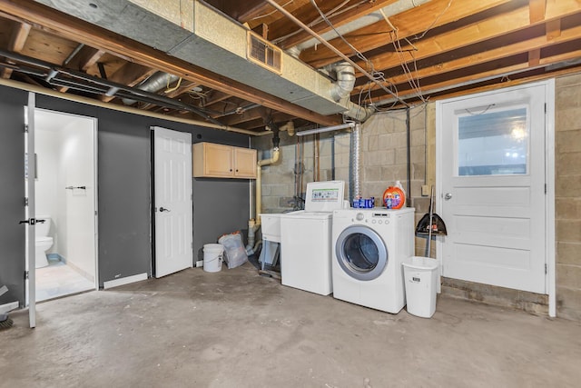 623 Pawnee St, Jackson, MI 49203 - unfinished below grade area with washing machine and dryer and concrete block wall