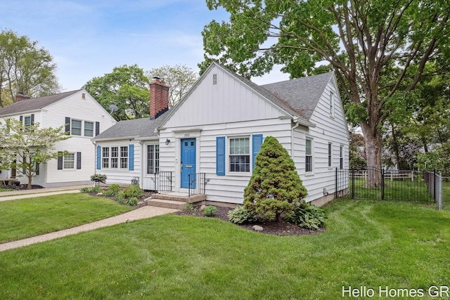 2052 Gorham Dr SE, East Grand Rapids, MI 49506 - view of front facade featuring a shingled roof, board and batten siding, and a chimney