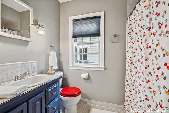 2052 Gorham Dr SE, East Grand Rapids, MI 49506 - full bath featuring toilet, vanity, tasteful backsplash, a shower with curtain, and baseboards