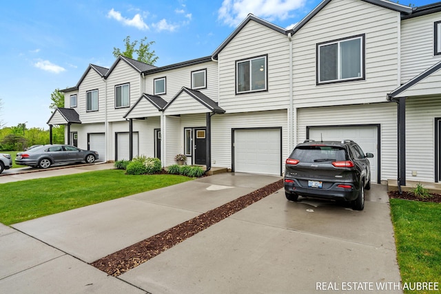 392 Harbor Town Ct Unit 2, Holland, MI 49423 - view of property featuring a garage, driveway, and a front yard
