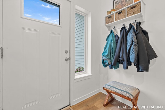 392 Harbor Town Ct Unit 2, Holland, MI 49423 - mudroom featuring wood finished floors and baseboards