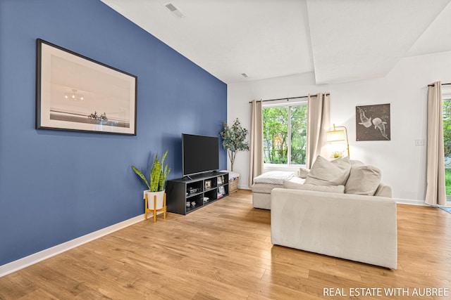 392 Harbor Town Ct Unit 2, Holland, MI 49423 - living room with wood finished floors and baseboards