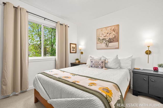 392 Harbor Town Ct Unit 2, Holland, MI 49423 - bedroom with light carpet and baseboards