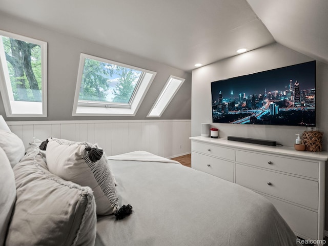 1017 N Connecticut Ave, Royal Oak, MI 48067 - bedroom with a skylight, a wainscoted wall, lofted ceiling, and wood finished floors