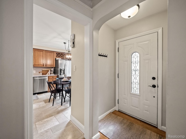 1017 N Connecticut Ave, Royal Oak, MI 48067 - entrance foyer with baseboards, arched walkways, and a chandelier