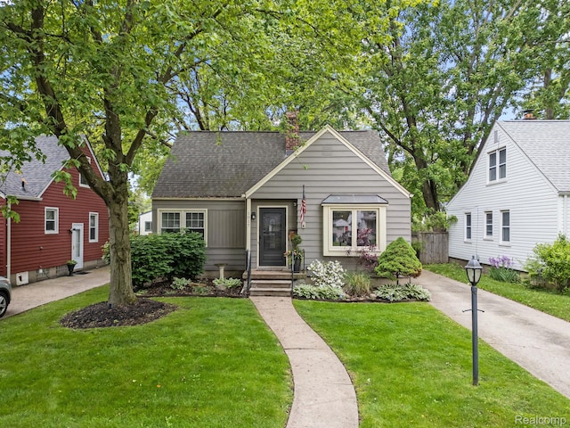 1017 N Connecticut Ave, Royal Oak, MI 48067 - bungalow-style house with a shingled roof and a chimney
