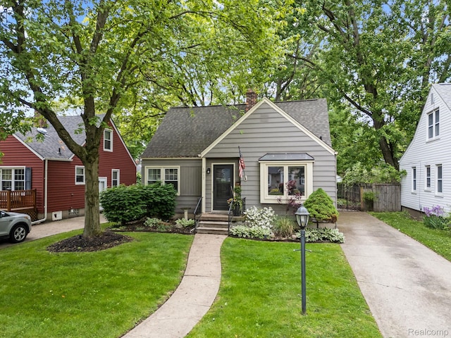 1017 N Connecticut Ave, Royal Oak, MI 48067 - bungalow with concrete driveway, a chimney, and roof with shingles