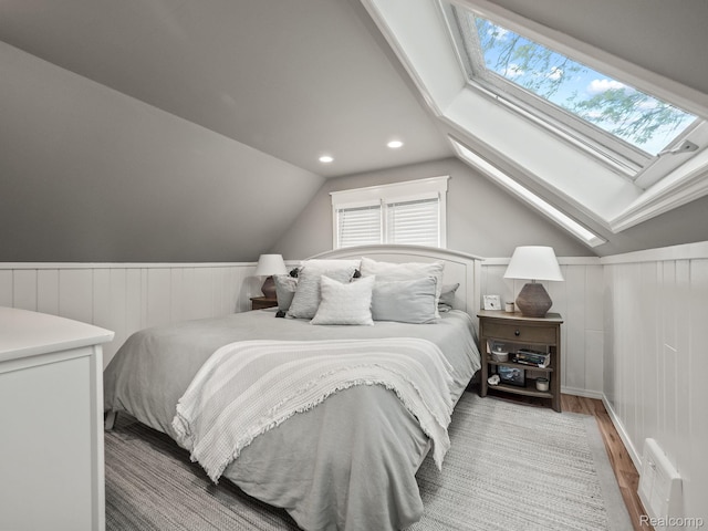 1017 N Connecticut Ave, Royal Oak, MI 48067 - bedroom with multiple windows, wood finished floors, a skylight, a wainscoted wall, and vaulted ceiling