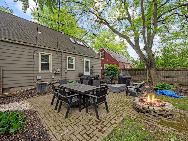 1017 N Connecticut Ave, Royal Oak, MI 48067 - fenced backyard featuring a fire pit, a patio area, cooling unit, a grill, and outdoor dining area