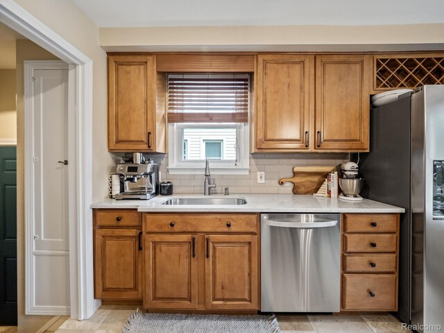 1017 N Connecticut Ave, Royal Oak, MI 48067 - kitchen with appliances with stainless steel finishes, a sink, light countertops, and brown cabinets