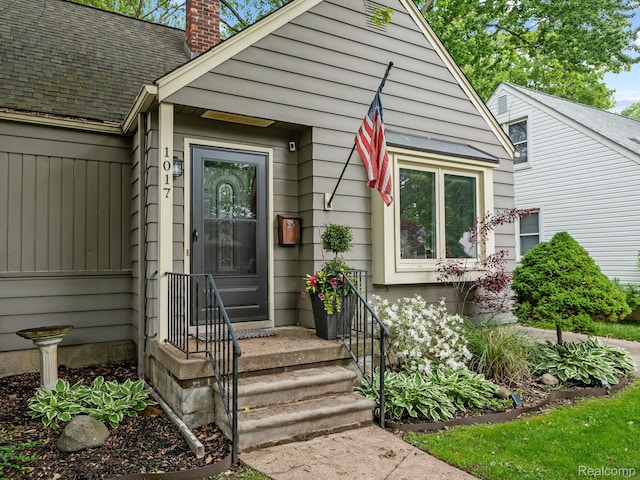 1017 N Connecticut Ave, Royal Oak, MI 48067 - entrance to property with a chimney and roof with shingles