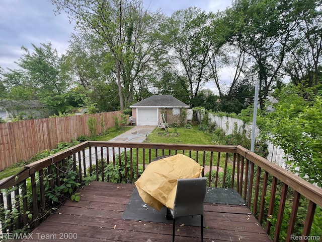 6101 Auburn St, Detroit, MI 48228 - wooden deck with an outbuilding, a fenced backyard, a garage, and driveway