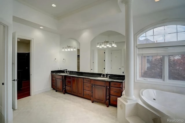 2571 N Long Lake Rd, Fenton, MI 48430 - full bathroom featuring double vanity, a bath, plenty of natural light, ornate columns, and recessed lighting