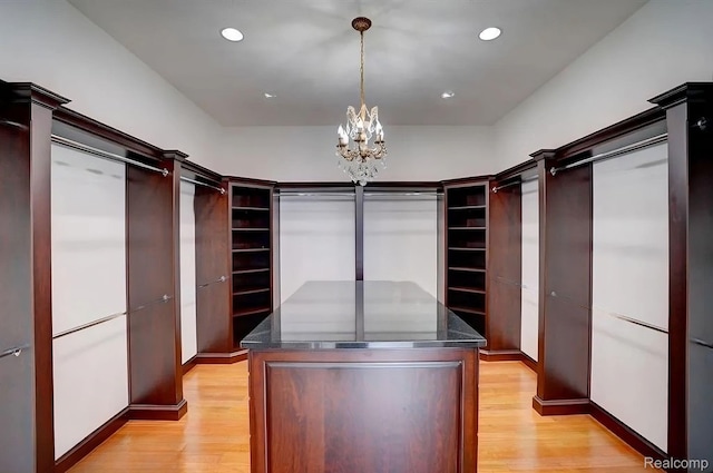 2571 N Long Lake Rd, Fenton, MI 48430 - spacious closet with a chandelier and light wood finished floors