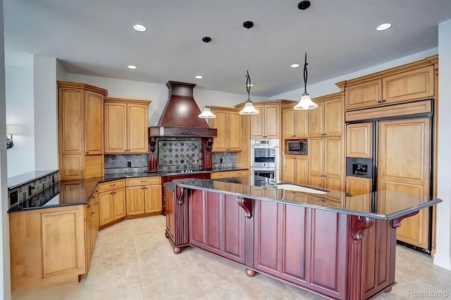2571 N Long Lake Rd, Fenton, MI 48430 - kitchen with built in appliances, dark countertops, premium range hood, a kitchen island with sink, and light tile patterned flooring