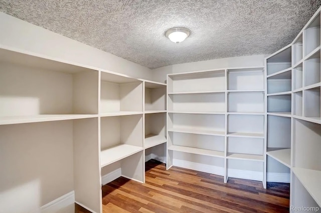 2571 N Long Lake Rd, Fenton, MI 48430 - walk in closet with wood finished floors