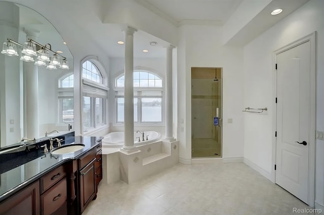 2571 N Long Lake Rd, Fenton, MI 48430 - bathroom featuring decorative columns, a shower stall, a bath, vanity, and recessed lighting