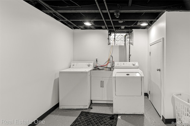 15237 Oceana Ave, Allen Park, MI 48101 - laundry room with washing machine and dryer, cabinet space, and baseboards