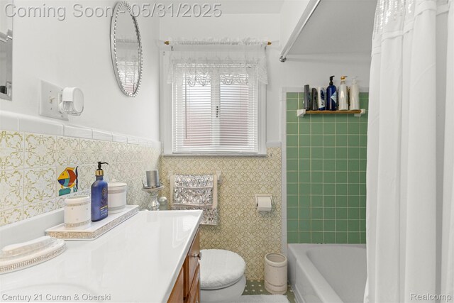 15210 Russell Ave, Allen Park, MI 48101 - full bath featuring vanity, toilet, wainscoting, shower / bath combo, and tile walls