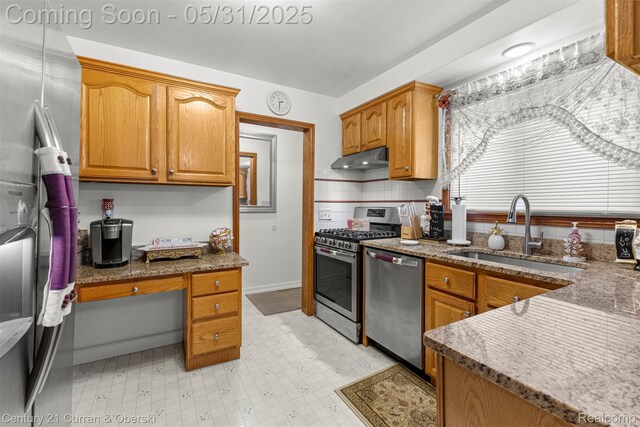 15210 Russell Ave, Allen Park, MI 48101 - kitchen with appliances with stainless steel finishes, a sink, under cabinet range hood, and dark stone counters
