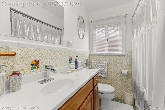 15210 Russell Ave, Allen Park, MI 48101 - full bath featuring toilet, a wainscoted wall, vanity, and tile walls