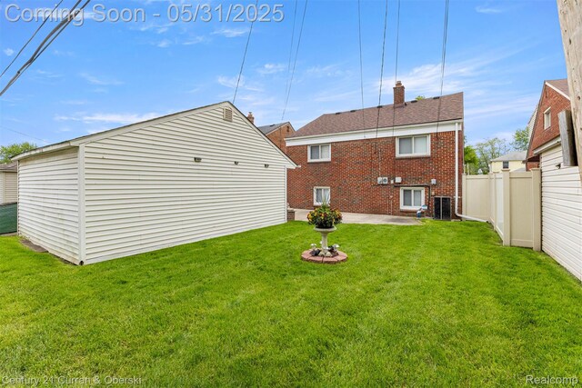 15210 Russell Ave, Allen Park, MI 48101 - rear view of house with brick siding, a chimney, a patio, and roof with shingles