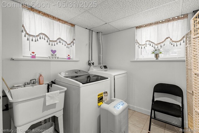 15210 Russell Ave, Allen Park, MI 48101 - washroom with washer and dryer, light tile patterned flooring, and baseboards