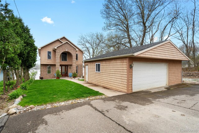 11589 Ember, Davisburg, MI 48350 - view of front facade featuring an outbuilding, a garage, and a front lawn