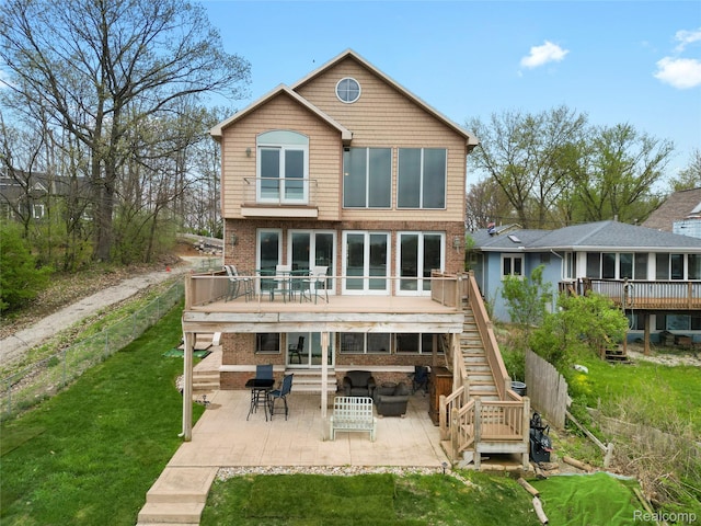11589 Ember, Davisburg, MI 48350 - back of house with a patio, stairway, a wooden deck, and a yard