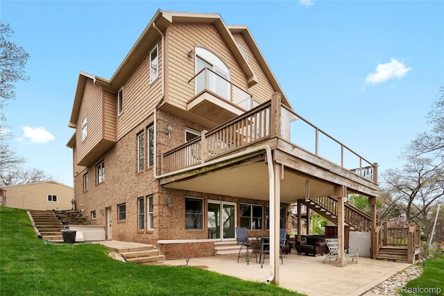 11589 Ember, Davisburg, MI 48350 - rear view of house featuring stairway, brick siding, a patio, a wooden deck, and a lawn