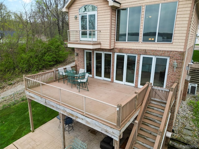 11589 Ember, Davisburg, MI 48350 - deck with central AC, a patio area, and outdoor dining area