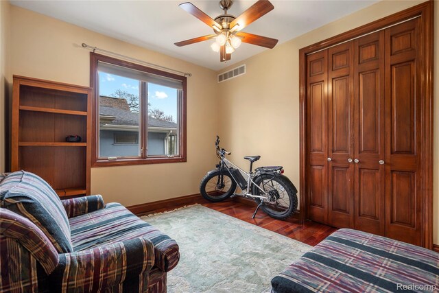11589 Ember, Davisburg, MI 48350 - living room featuring wood finished floors, a ceiling fan, and baseboards