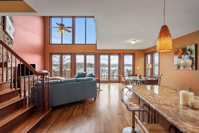 11589 Ember, Davisburg, MI 48350 - living area with wood-type flooring, a ceiling fan, and stairway