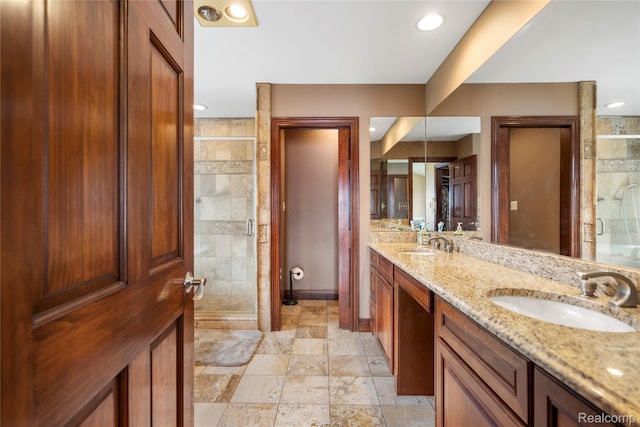 11589 Ember, Davisburg, MI 48350 - full bathroom featuring double vanity, a shower stall, stone tile floors, baseboards, and recessed lighting