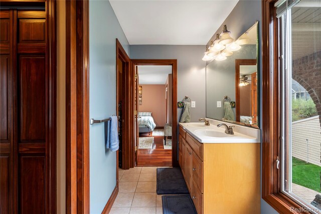 11589 Ember, Davisburg, MI 48350 - full bathroom featuring connected bathroom, double vanity, tile patterned flooring, and a closet