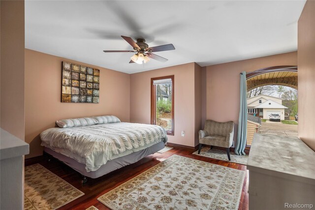 11589 Ember, Davisburg, MI 48350 - bedroom featuring baseboards, wood finished floors, access to outside, and a ceiling fan