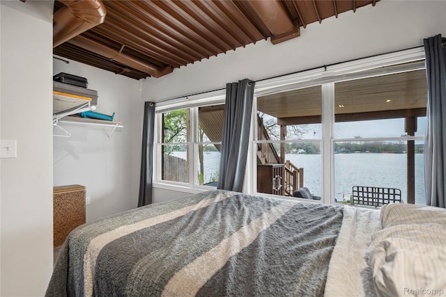 11589 Ember, Davisburg, MI 48350 - bedroom with a water view, access to outside, and beam ceiling