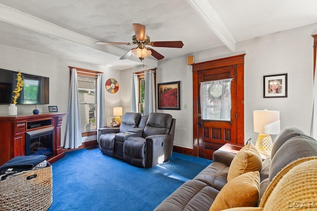 134 W Lagrange St, Morenci, MI 49256 - living room with a ceiling fan, carpet flooring, beamed ceiling, a glass covered fireplace, and baseboards