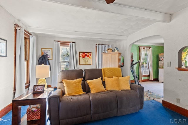 134 W Lagrange St, Morenci, MI 49256 - carpeted living area with arched walkways, beam ceiling, healthy amount of natural light, baseboards, and cooling unit