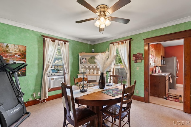 134 W Lagrange St, Morenci, MI 49256 - dining area with plenty of natural light, light carpet, ceiling fan, and ornamental molding