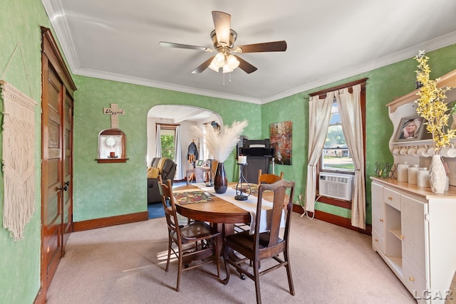 134 W Lagrange St, Morenci, MI 49256 - dining area with arched walkways, light carpet, a ceiling fan, ornamental molding, and baseboards