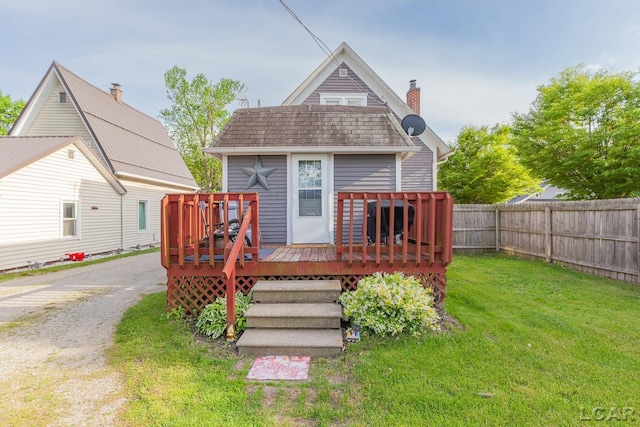 134 W Lagrange St, Morenci, MI 49256 - rear view of property featuring a wooden deck and a chimney