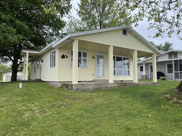 583 Pearl Beach Dr, Coldwater, MI 49036 - view of front of house featuring a front yard and a porch