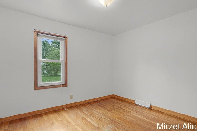 1145 Eastmont Dr SE, Grand Rapids, MI 49546 - unfurnished room with baseboards and light wood-style floors