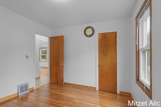 1145 Eastmont Dr SE, Grand Rapids, MI 49546 - empty room with wood finished floors and baseboards